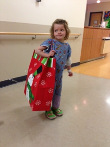 Christmas gifts from UT athletes - this bag is nearly as big as she is!